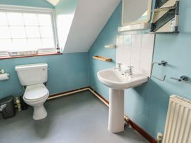 A bathroom with a toilet and sink at Glan y Gors in Dinorwic near Llanberis