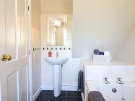 A bathroom with a sink and a bath at Peniarth in Penybontfawr near Oswestry