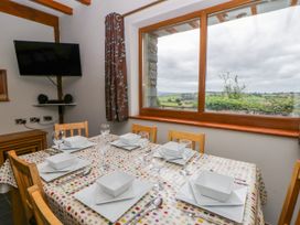 A dining room with a table set for a meal at Y Bwthyn in Swyddffynnon near Pontrhydfendigaid