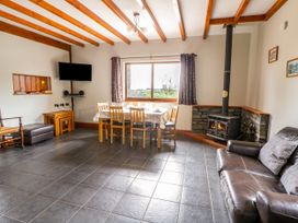 A dining room with a table and chairs at Y Bwthyn in Swyddffynnon near Pontrhydfendigaid