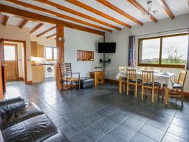 A dining room with a table and chairs at Y Bwthyn Swyddffynnon near Pontrhydfendigaid