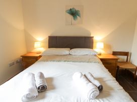 A bedroom with a bed and bedside tables at Y Bwthyn in Swyddffynnon near Pontrhydfendigaid