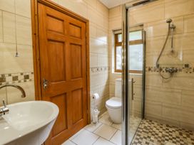 A bathroom with a sink, toilet, and shower at Y Bwthyn in Swyddffynnon near Pontrhydfendigaid