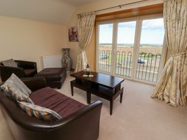 A living room with a sofa and coffee table at Granary Stone House in Embleton