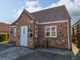 A house with a door and windows at Heather Croft in Robin Hood's Bay