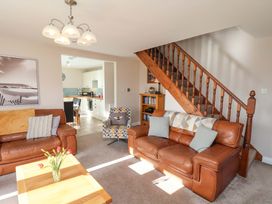 A living room with a sofa and coffee table at Heather Croft in Robin Hood's Bay