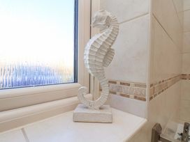 A seahorse sculpture on a surface next to a window at Heather Croft Robin Hood's Bay