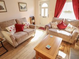 A living room with two sofas and a coffee table at 29 High Street in Aldeburgh