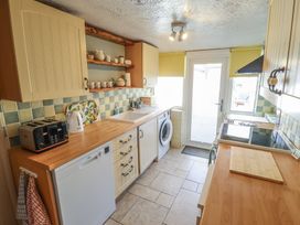 A kitchen with appliances and a countertop at 29 High Street in Aldeburgh