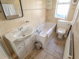 A bathroom with a bathtub and sink at 29 High Street in Aldeburgh