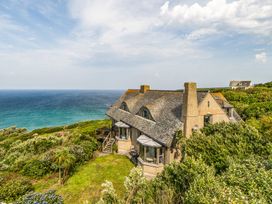 A house overlooking the ocean with a garden at Cragford in Sennen Cove