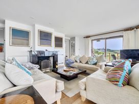 A living room with a sofa and a coffee table at Cragford in Sennen Cove