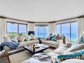 A living room with sofas and a coffee table at Cragford in Sennen Cove