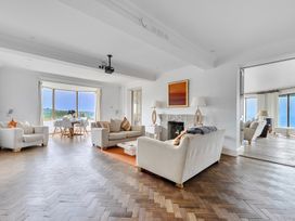 A living room featuring sofas and a dining area at Cragford in Sennen Cove