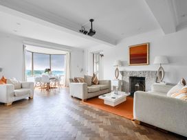 A living room with a sofa and coffee table at Cragford in Sennen Cove
