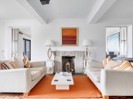 A living room with sofas and a coffee table at Cragford in Sennen Cove
