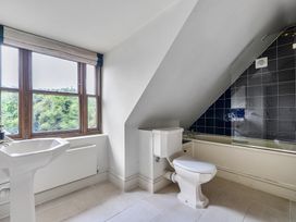 A bathroom with a sink, toilet, and bathtub at Cragford in Sennen Cove