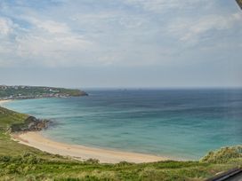 A coastal view with beach and sea at Cragford in Sennen Cove