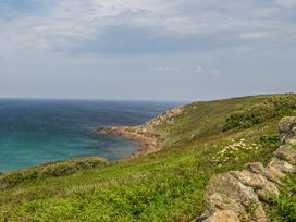 A coastal view featuring cliffs and the ocean at Cragford in Sennen Cove