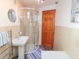 A bathroom with a shower and sink at Fairhaven Cottage Ugthorpe near Runswick Bay