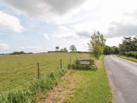 A field with a sign and a tower at Fairhaven Cottage Ugthorpe near Runswick Bay