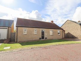 A house with a garden and pathway at The Haven in Embleton