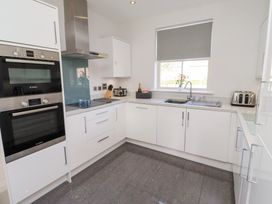A kitchen with modern appliances at The Haven in Embleton