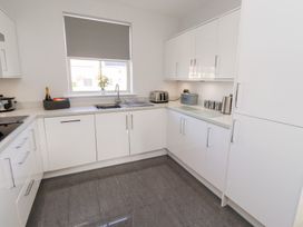 A kitchen with a sink and appliances at The Haven in Embleton