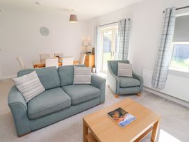 A living room with a sofa and armchair at The Haven in Embleton