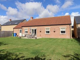A house with patio furniture in the outdoor area at The Haven in Embleton