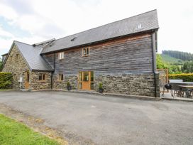 A house with windows and a driveway at The Hayloft in Bleddfa near Knighton