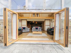 A living room with sofas and a coffee table at The Hayloft Bleddfa near Knighton