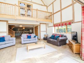 A living room with sofas and a coffee table at The Hayloft in Bleddfa near Knighton