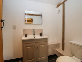 A bathroom with a sink and toilet at The Hayloft in Bleddfa near Knighton