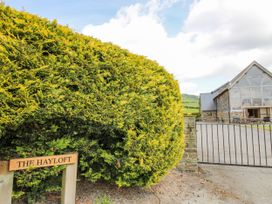 An outdoor view of The Hayloft and sign in Bleddfa near Knighton