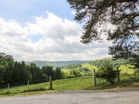 A landscape view with trees and hills at The Hayloft in Bleddfa near Knighton
