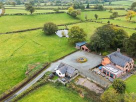 An outdoor view of a property with a house and garden at Ty Newydd in Llangadfan