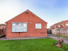 A house with grass and a pathway at La Rochelle in Whitby