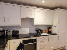 A kitchen with cabinets and appliances at La Rochelle in Whitby