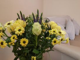 A bouquet of flowers in a living room at La Rochelle in Whitby
