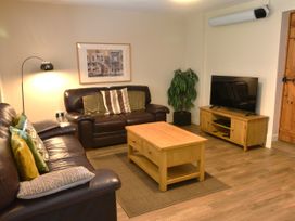 A living room with a sofa and coffee table at Red Kite in Blaenwaun