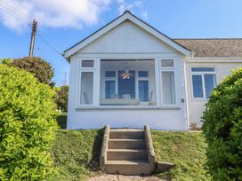 A house with steps leading to the entrance at Highdown in Bigbury on Sea near Modbury