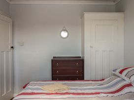 A bedroom with a bed and chest of drawers at Highdown Bigbury on Sea near Modbury