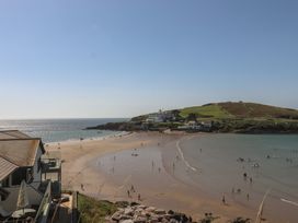 A beach with people enjoying the water at Highdown in Bigbury on Sea near Modbury