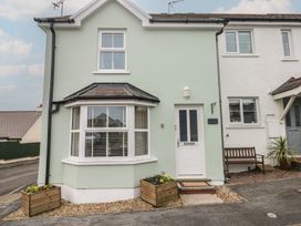 A house with a front door and window at Sandyhill House in Saundersfoot