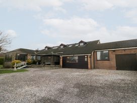 A house with a garage and driveway at Seacrest Lodge in Scarborough
