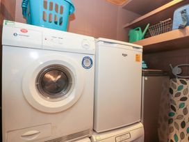 A laundry room with a washing machine and dryer at Seacrest Lodge Scarborough