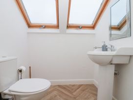 A bathroom with a toilet and sink at Seacrest Lodge in Scarborough