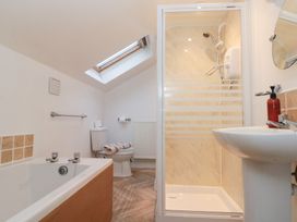 A bathroom with a bathtub and shower at Seacrest Lodge in Scarborough