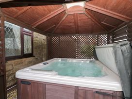 A hot tub enclosed in a wooden structure at Seacrest Lodge in Scarborough
